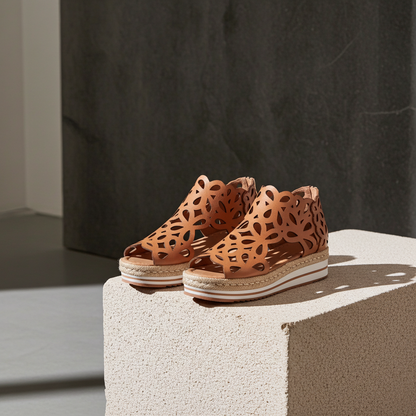 Pair of brown sandals with cut-out design